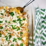 Mexican street corn bake in a glass baking dish.