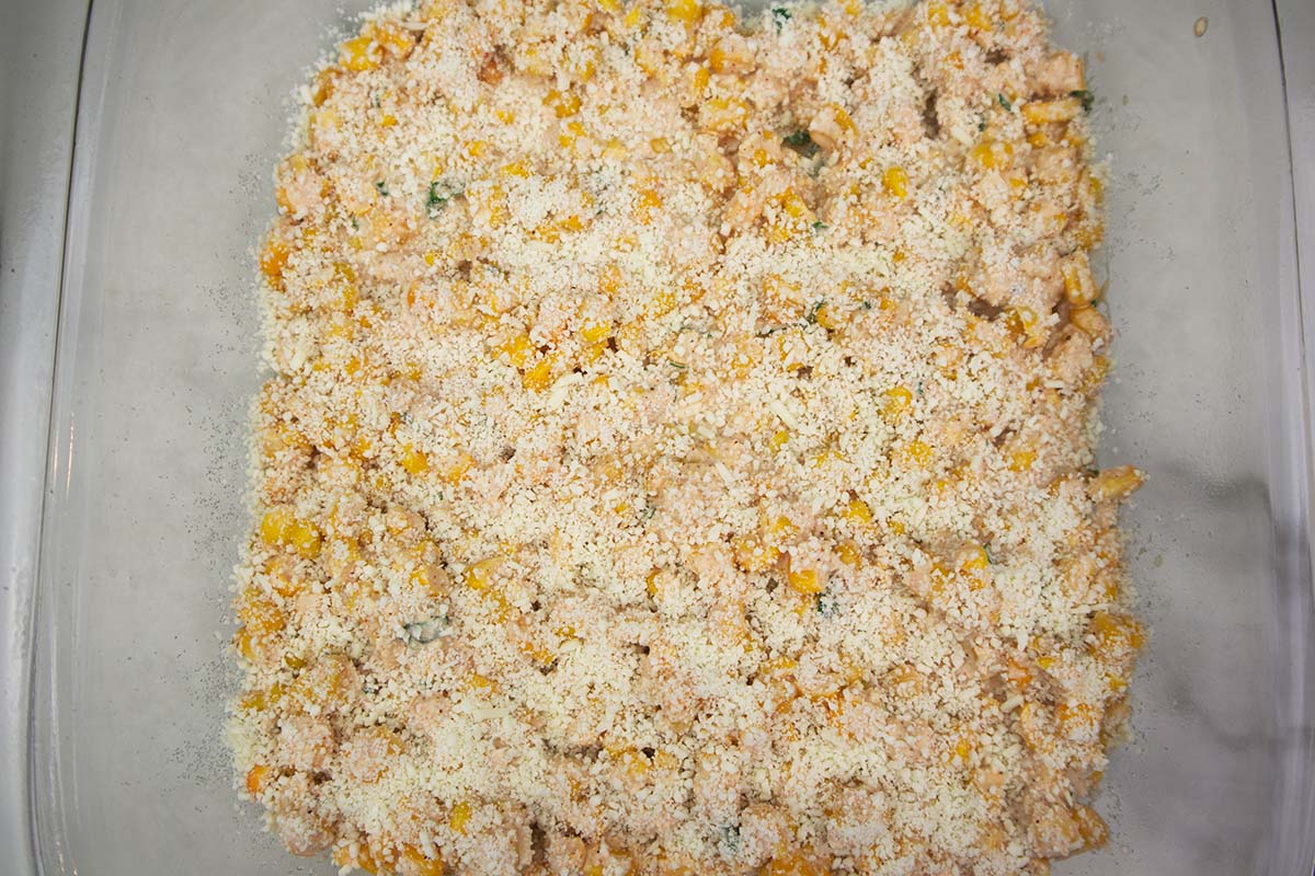 mexican corn in a glass baking dish.