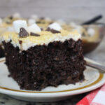 serving smores cake on tan plate