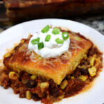 chili cornbread served on a white plate.