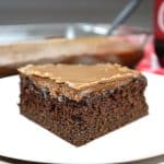 dr pepper cake slice in a white plate.