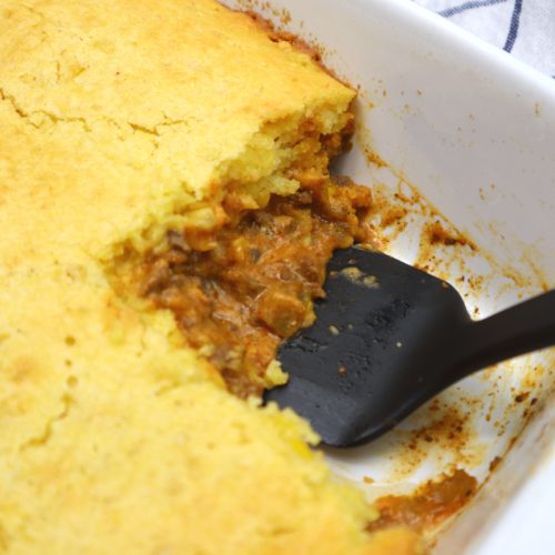 jiffy tamale casserole served in a white baking dish.
