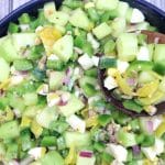 summer salad served with wooden spoon.