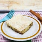 cinnamon roll sheet cake slice on a small plate.