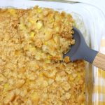 scalloped corn in a glass baking dish.