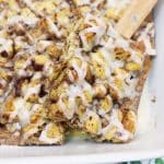 cinnamon roll casserole served in a large white baking dish.