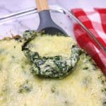 spinach au gratin served from a glass pan.