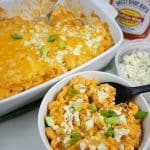 Buffalo Chicken Mac and Cheese in a white baking dish and white bowl.
