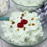 Watergate Salad or Pistachio Fluff served in a glass bowl.
