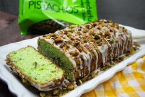 Pistachio Bread sliced on a white bread plate.