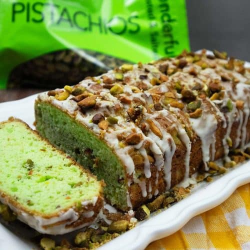 Pistachio Bread sliced on a white bread plate.