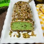 Pistachio Bread sliced on a white bread plate.