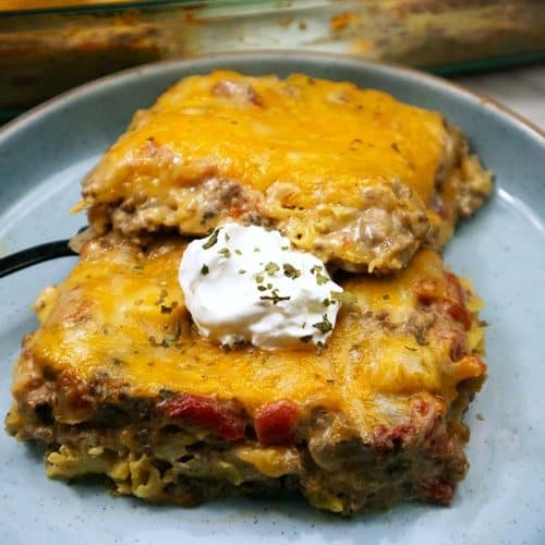 King Ranch Casserole slices on a blue plate.